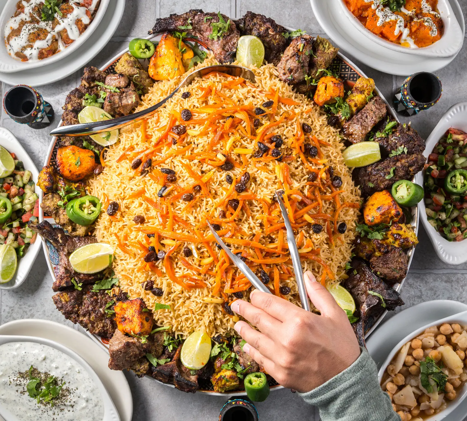 A generous Kabuli plov and grilled meat feast prepared by Aria Palace